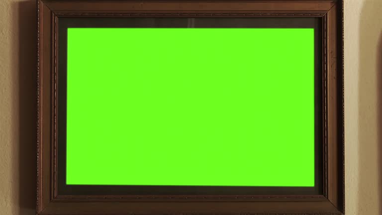 Old Wooden Frame with Green Background Close Up. Zoom In. 4K Resolution.