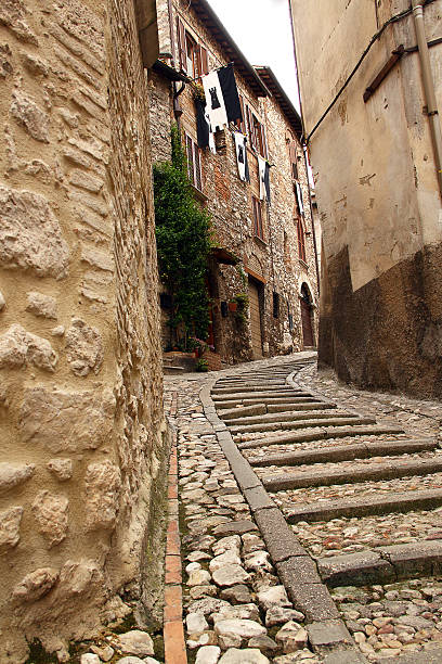 istock Narrow street between buildings (Narni, Umbria, Italy) 163035009