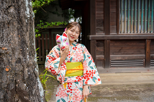 Woman wearing kimono at shrine