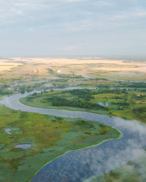 istock Top view misty dawn over the river hills landscape 1630351709