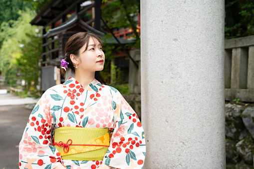 Woman wearing kimono at shrine