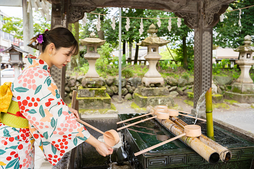 Woman wearing kimono at shrine