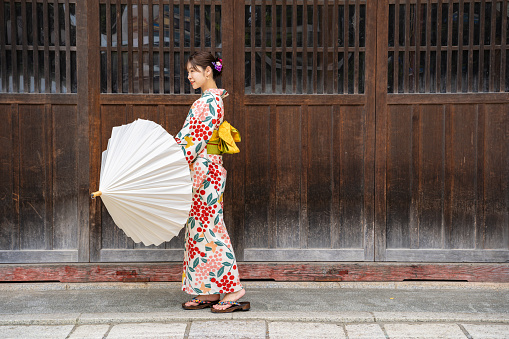 Woman wearing kimono at shrine