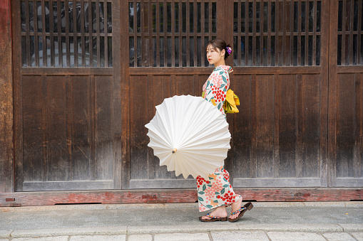 Woman wearing kimono at shrine