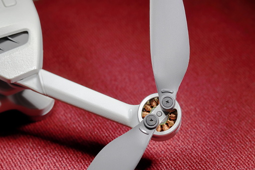 Small drone motor with propeller blades