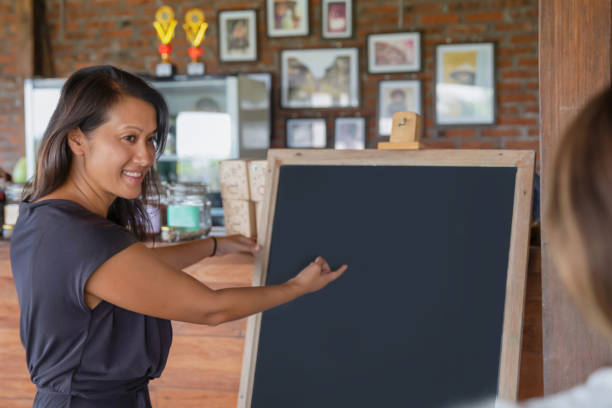 istock Vietnamese Female Entrepreneur Presenting Ideas at Co-working Space 1630421256