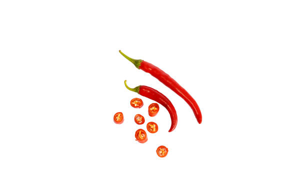 istock Organic two red chili peppers with sliced isolated on white background. Studio shot copy space 1630423456