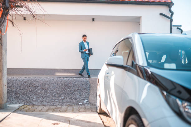 istock Environmentally Responsible Man Walking To His Car 1630445074