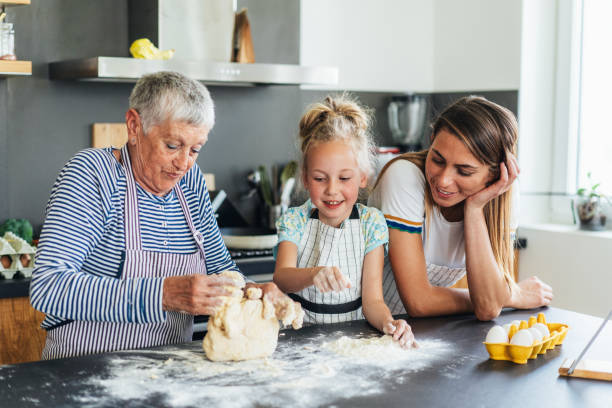 istock Three generation women making cookies and have fun 1630474670