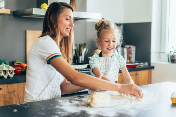 istock Mother and daughter baking 1630474674