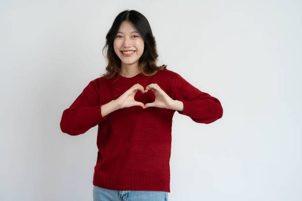 istock Young Asian woman making head portrait with hands on white background 1630484350