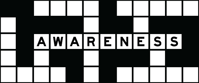 Alphabet letter in word awareness on crossword puzzle background