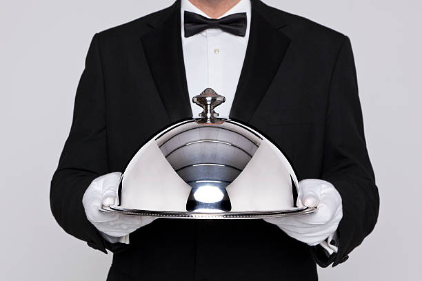istock Waiter holding a silver cloche 163052586
