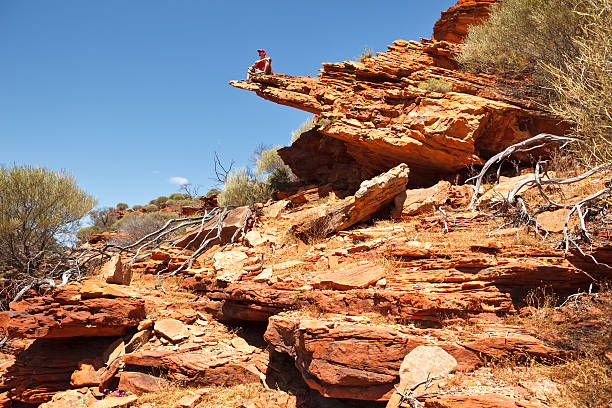 istock Man sitting on the rock edge 163052672