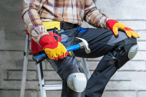 istock Handyman with a tool belt against concrete wall background.  home improvement work. 1630611020