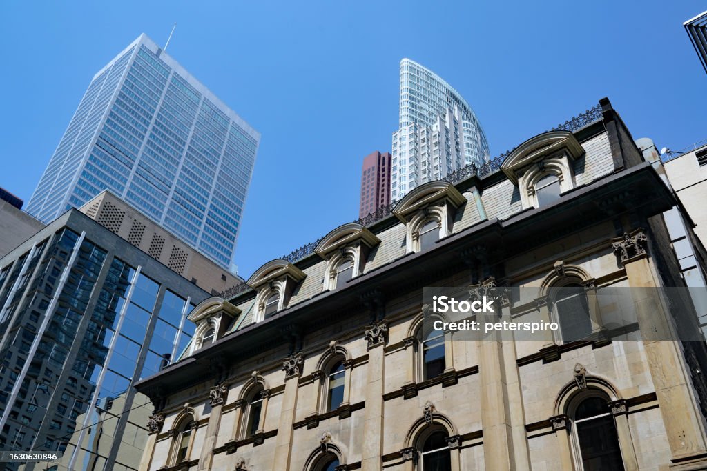 A bank building from the 1870s A bank building from the 1870s on King Street in Toronto, with modern financial district skyscrapers in the  background Bank - Financial Building Stock Photo
