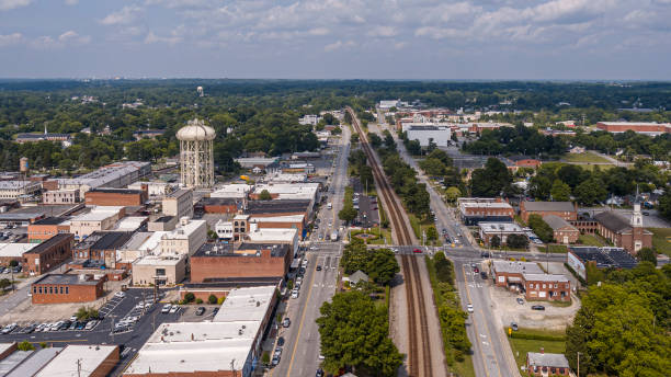 istock Technological nodes of industrial landscape: Industrial District with Cell Tower along Main Street in Thomasville, NC. Aerial view 1630645278
