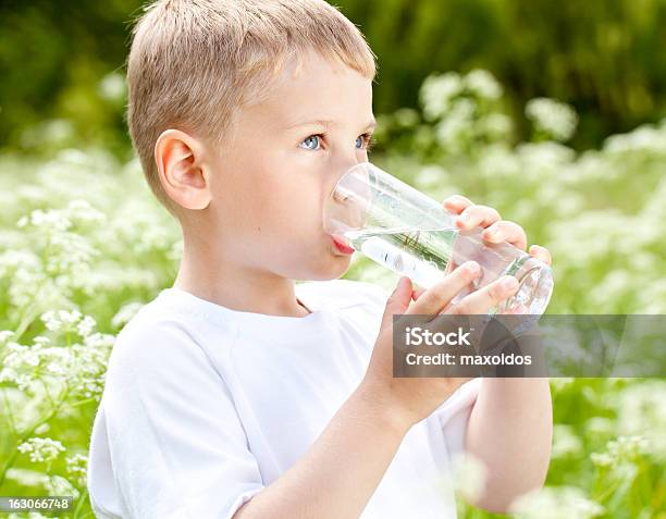 Child Drinking Pure Water Stock Photo - Download Image Now - Boys, Child, Childhood