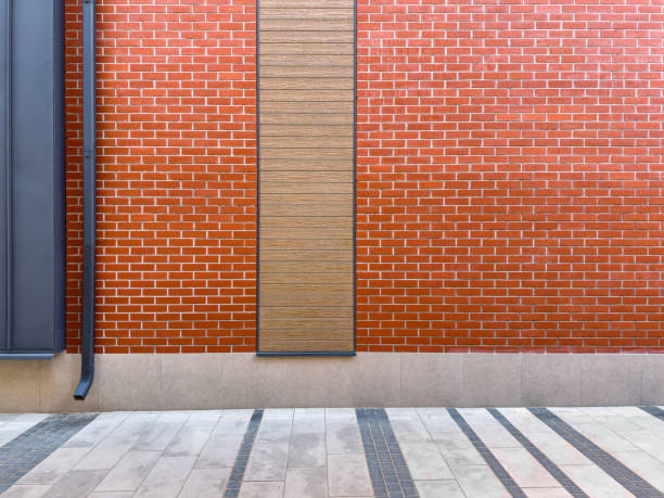 istock bright red brick wall of renovated building with modern architectural elements. 1630668112