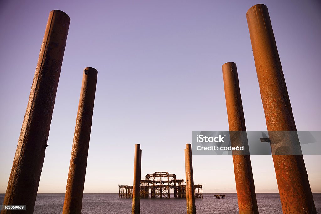 Burnt Brighton West Pier au lever du jour - Photo de Bras de mer - Mer libre de droits