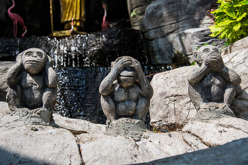 The three monkeys statue at the Golden Mount or Phu Khao Thong (Wat Saket), Bangkok, Thailand