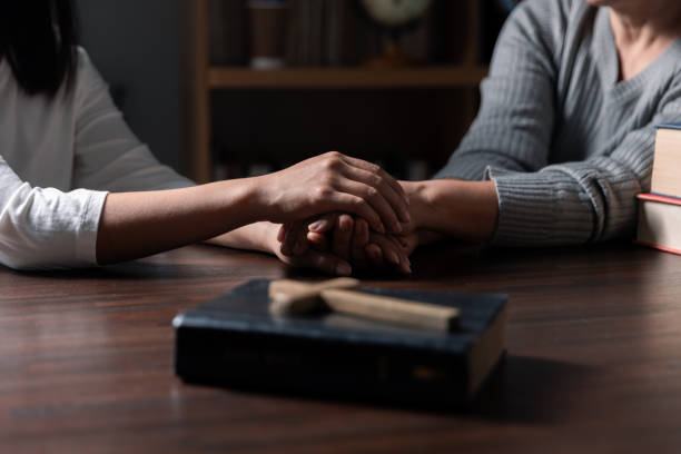 istock Group of different women praying together, Christians and Bible study concept. 1630731930