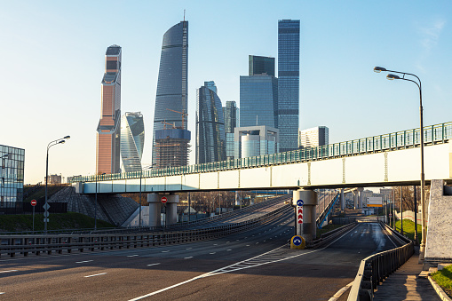 An empty highway and modern business quarter Moscow city on the horizon