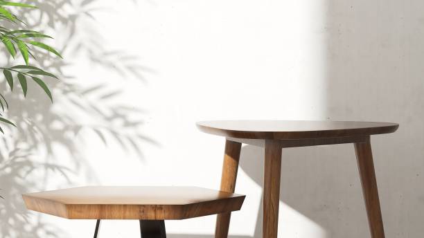 istock Two geometric wooden pedestal side table podium in different level, green bamboo tree in sunlight, white cement wall. 1630737892