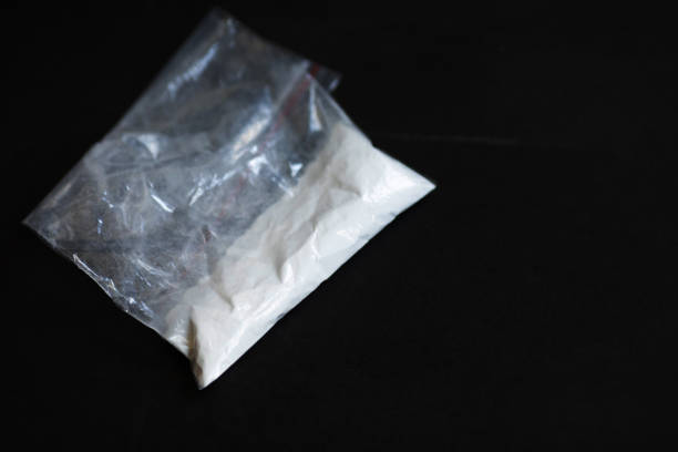 istock Cocaine in a plastic package on a black background
. 1630738768