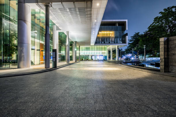 istock Walkway road and modern building at night 1630744406