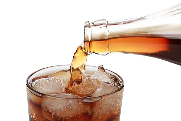 istock Cola pouring into a glass 163074589