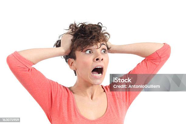 Hysterical Woman Expression With Her Hands On The Head Stock Photo - Download Image Now