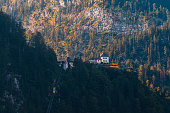 Skywalk lookout on hill above village Hallstatt with cable car, Austria