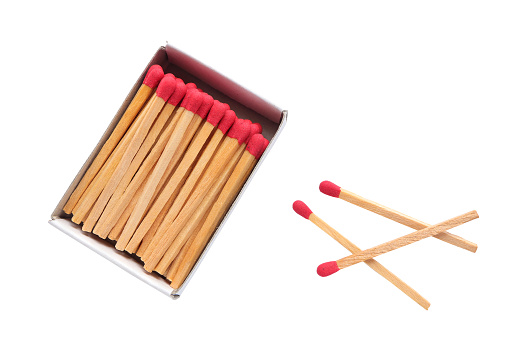 Top view of opened match box with matches inside and piles matchstick isolated on white background with clipping path.