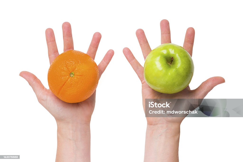 Differentiate apples from oranges Compare apples with oranges (conceptual) Apple - Fruit Stock Photo