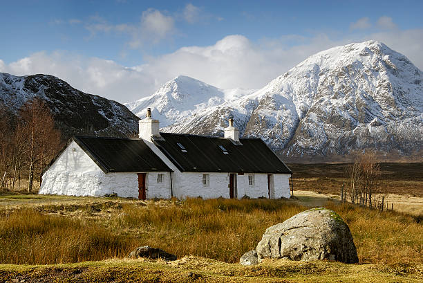 Blackrock Cottage, Glencoe, Scotland Winter view of Black Rock Cottage, Glencoe, Scotland with snow capped mountains in the background. scottish highlands stock pictures, royalty-free photos & images