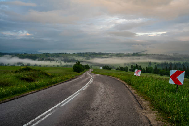 Mountain road during a foggy morning