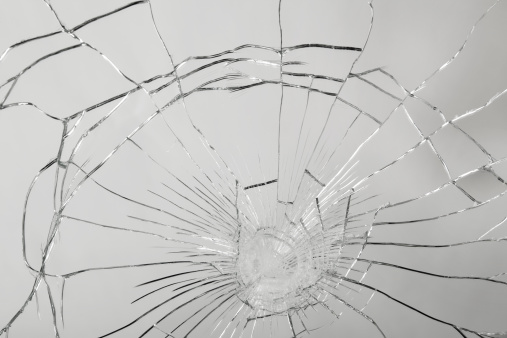 Bulletproof glass after being tested with three shots.