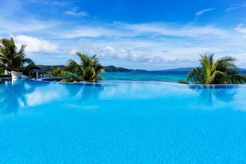 beautiful infinity swimming pool in a luxury tourist resort.