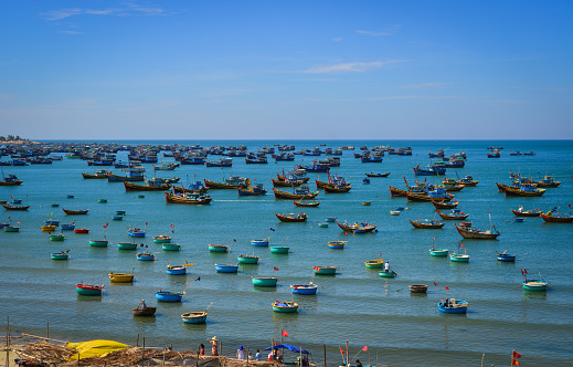 Fishing boats on sea in Nha Trang, Vietnam. Nha Trang is well known for its beaches and scuba diving and has developed into a popular destination for tourists.