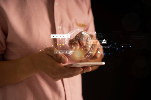 istock Businessman in a black suit using a chatbot on an AI smartphone. GPT chat, chatting with AI artificial intelligence on data screen and data linking and perception with satisfaction service. 1630887690