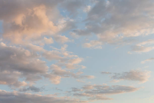 istock Beautiful fluffy clouds painted in bright painterly colors at sunrise. Multicolor background or wallpaper 1630892962