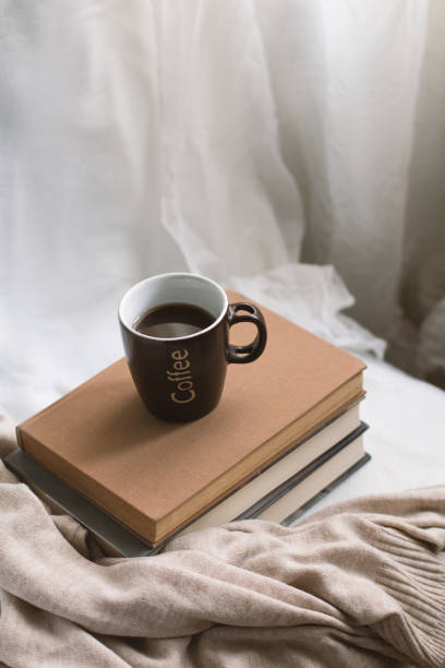 istock Simple composition of indoor relaxation with coffee and books. 1630942324