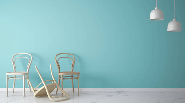 istock Minimalist architect designer concept with three classic wooden chairs, one chair turned over on blue background and marble floor, living room interior design with copy space 1630953394