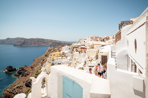 Oia village in the foreground and Cyclades islands in the background.