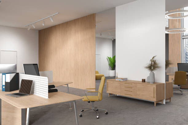 istock Cozy coworking interior with pc computer, table and drawer with mock up wall 1630964541
