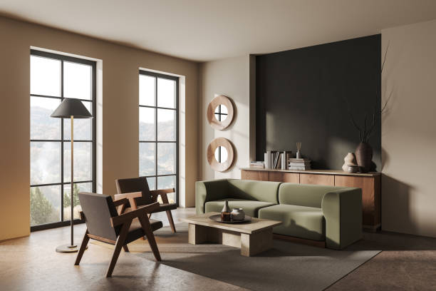 istock Cozy living room interior with armchair and couch with decor, panoramic window 1630966186