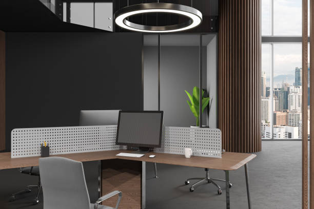 istock Grey office room interior with pc computer on desk, plant and panoramic window 1630967270
