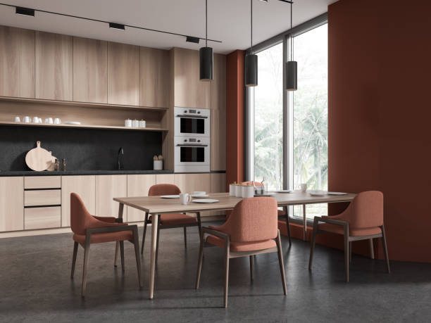 istock Stylish home kitchen interior with cooking and eating corner, panoramic window 1630970841