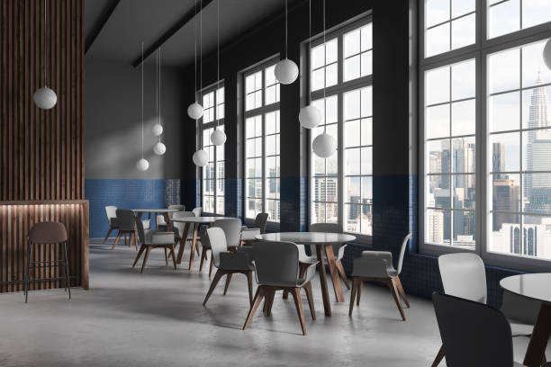 istock Stylish cafeteria interior with dining table and chairs in row, panoramic window 1630972237